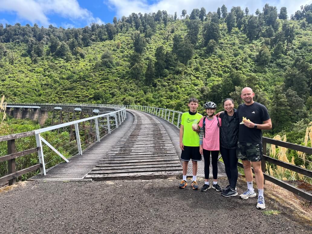 Carina Barnett and family cycling the Old Coach Road in Ohakune over summer (quick break for some lunch) Juno Legal